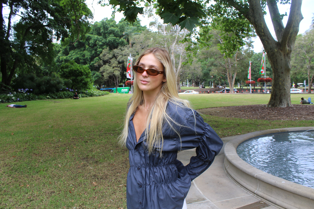 Tate wearing Gigi Zodiac